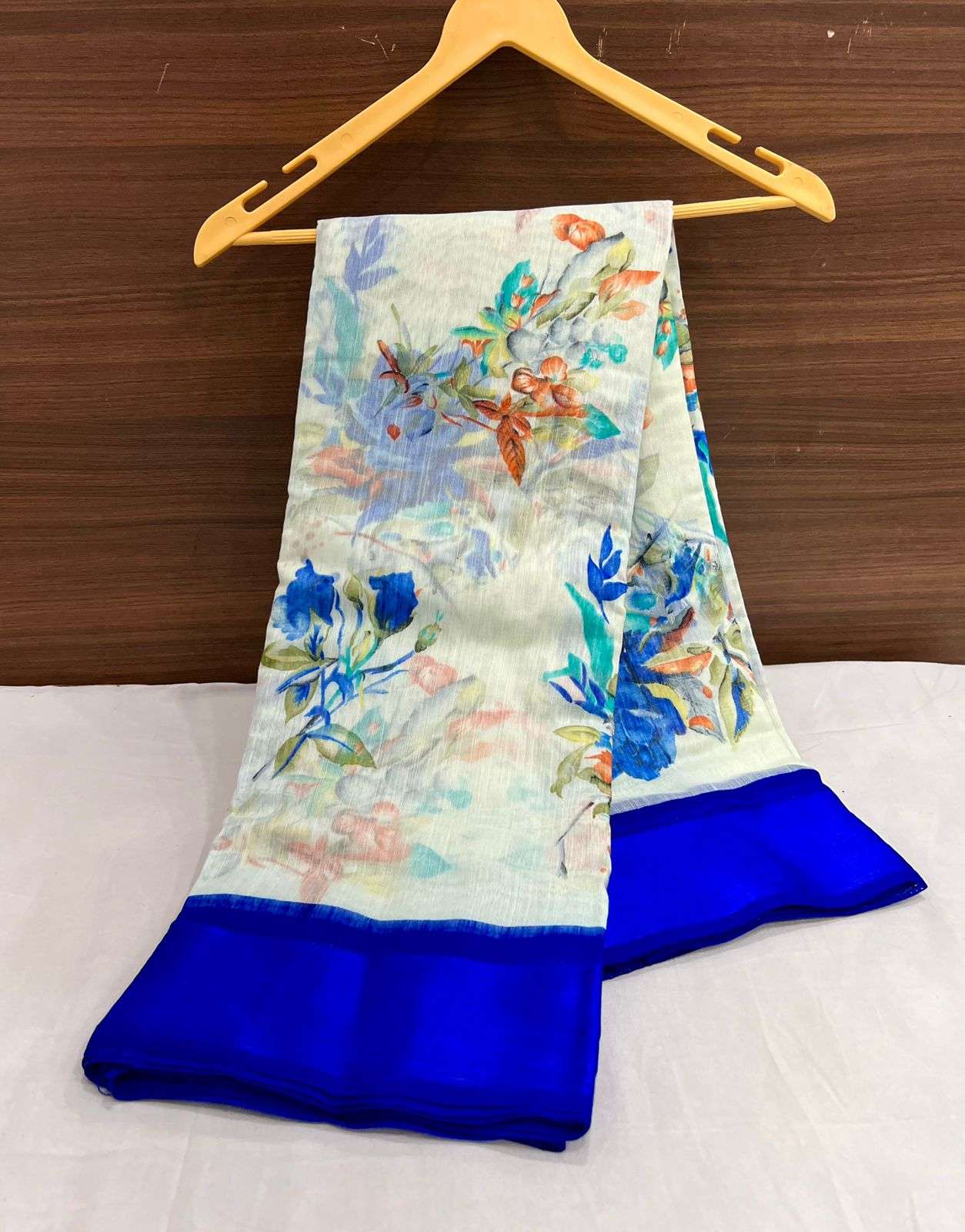 Soft linen silk saree with floral design and contrast blouse...