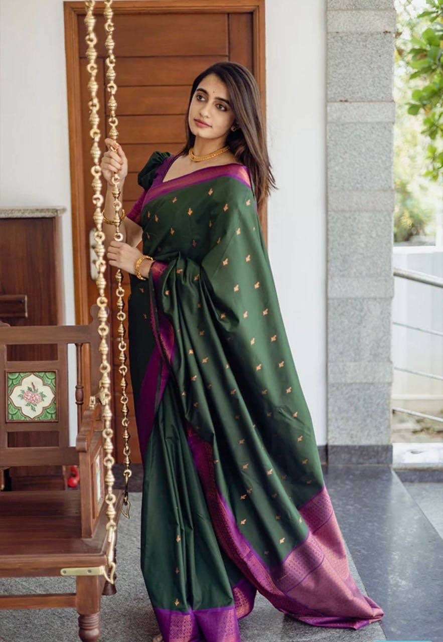 Deep green vasundhara silk mix saree with zari buttas,contrast traditional  zari border & intricate pallu