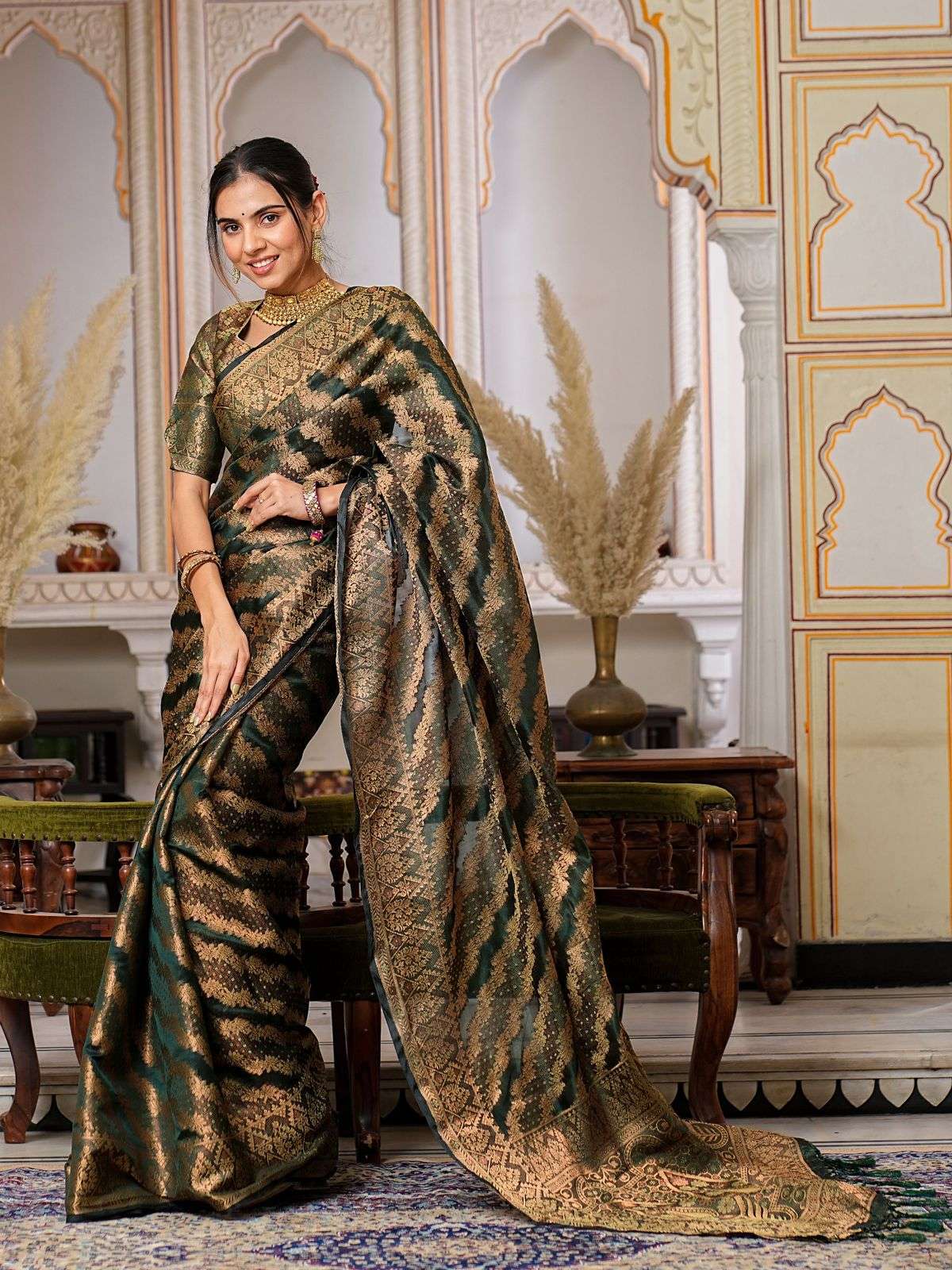 Dark Green Color Pure Organza Saree Adorned with Zari Weavin...