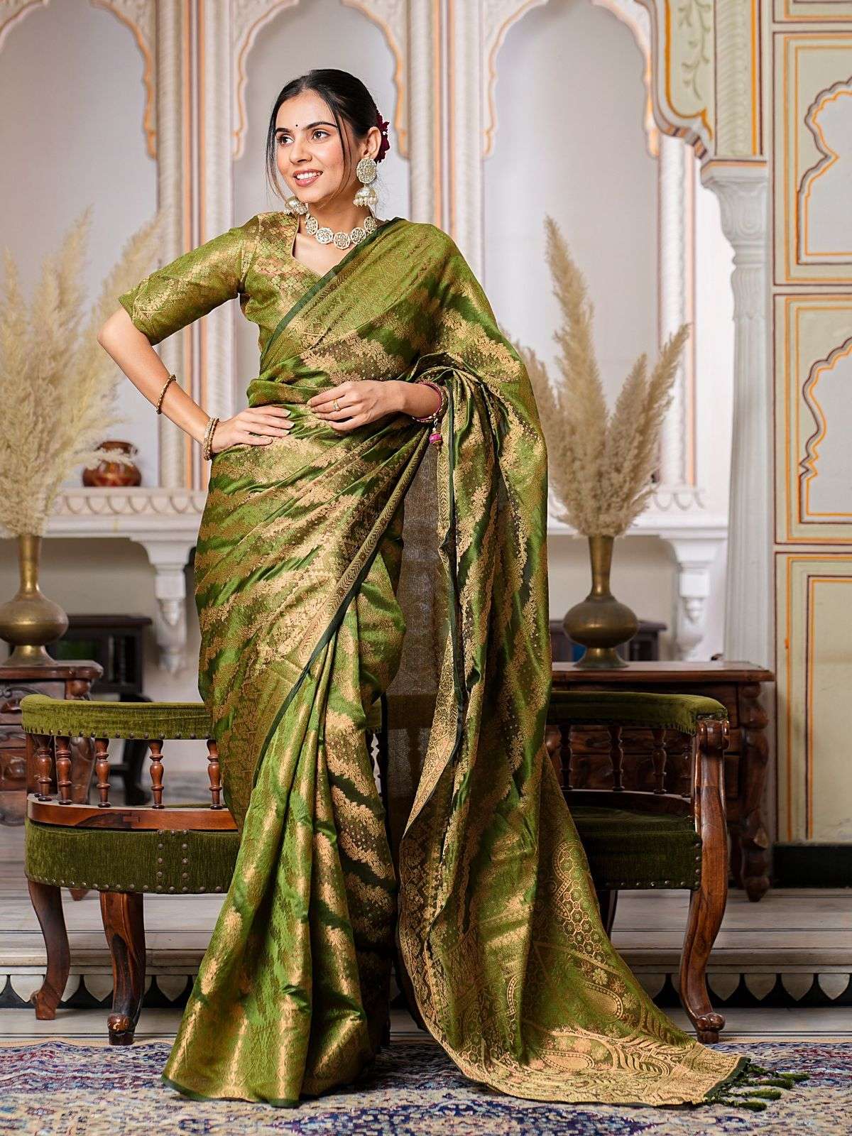Mehandi GreenColor Pure Organza Saree Adorned with Zari Weav...