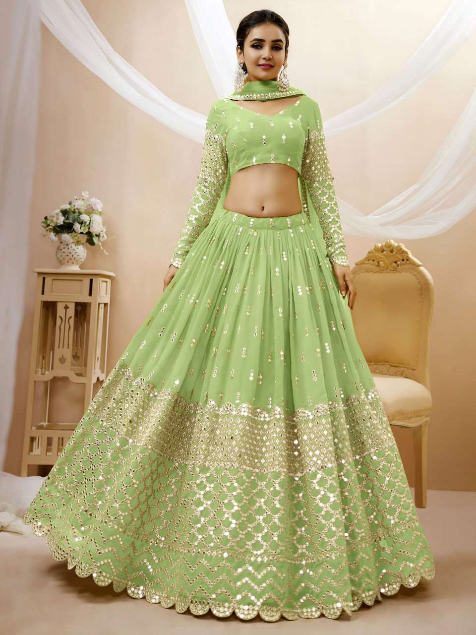 A soft Pistachio green georgette fabric adorned with delicat...