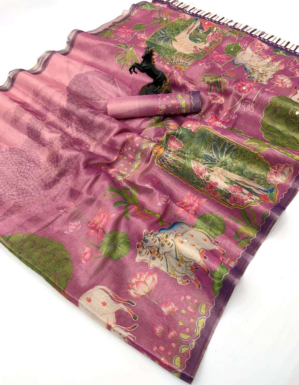 This Tissue Silk fabric with Aari Work has a soft shine and ...