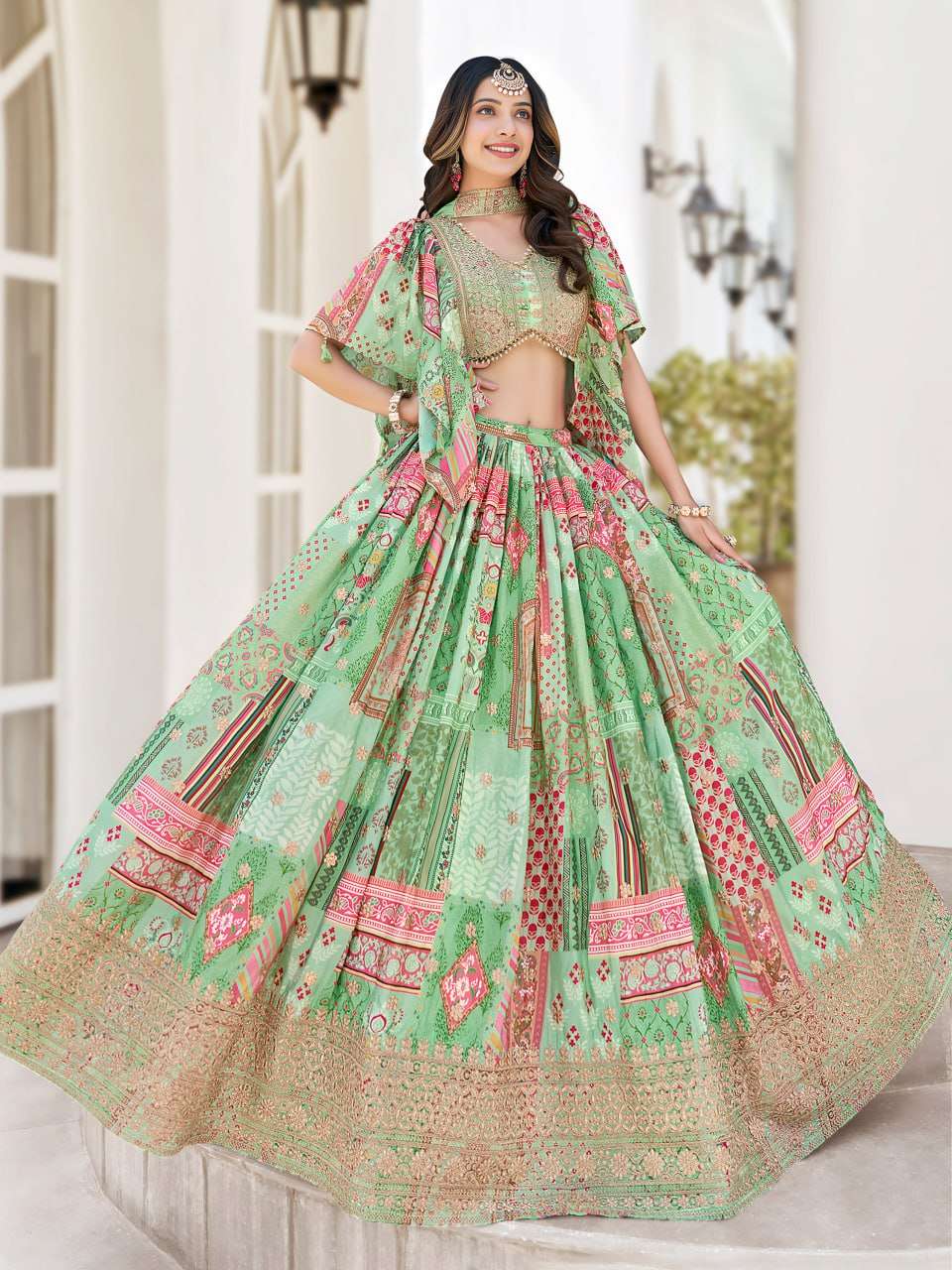  Green This pastel green chinnon silk fabric features a ric...