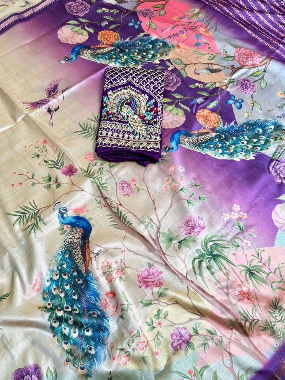   this is made from Malai Silk fabric It has beautiful peaco...