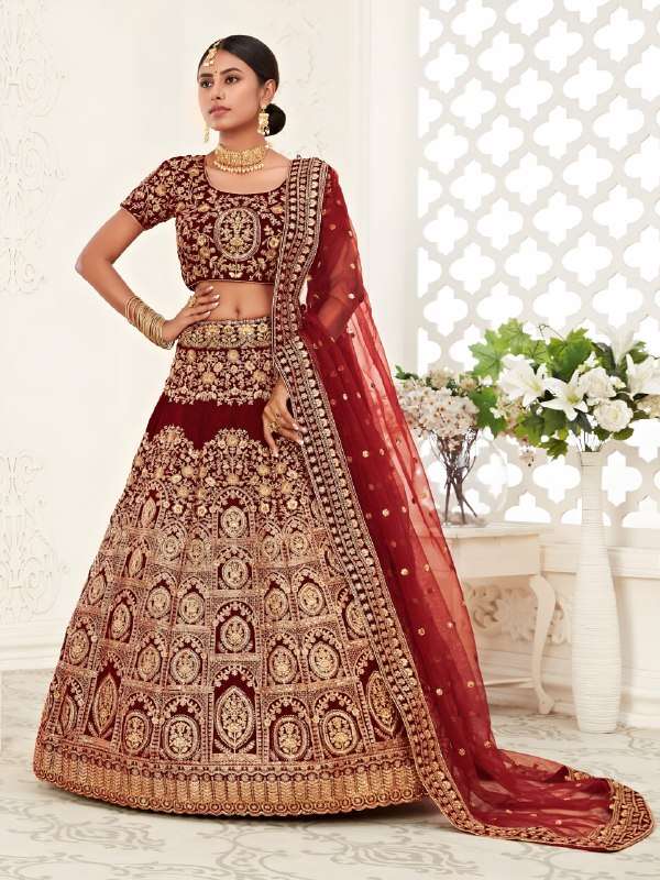 Maroon velvet fabric bridal lehenga with heritage zari embro...