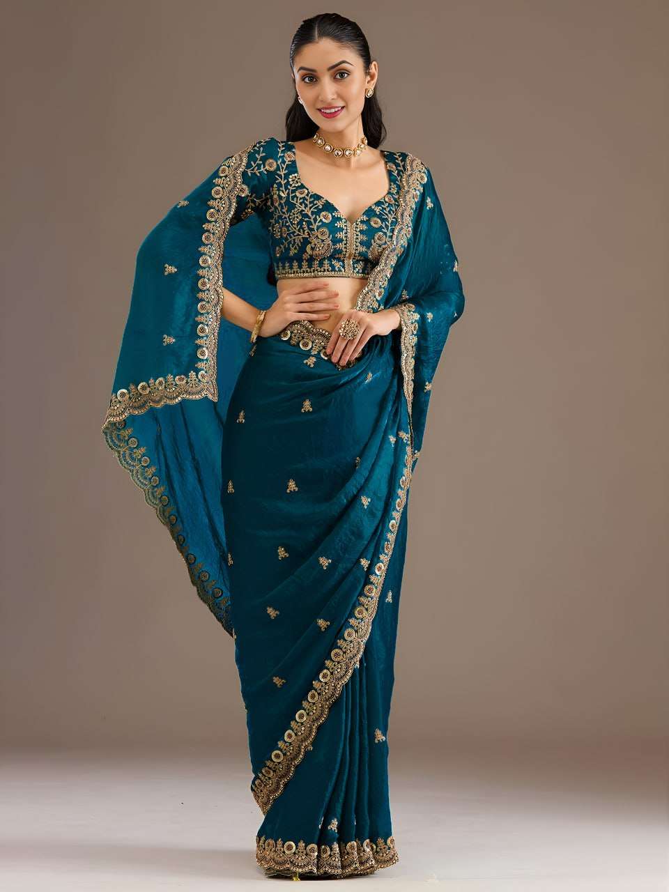 Rich teal blue tissue fabric crafted in a soft and flowy sar...