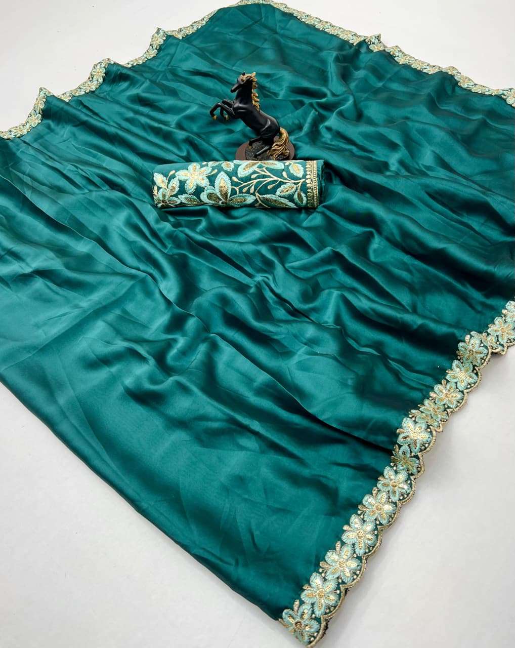This elegant Rangoli silk fancy fabric has a soft shine and ...