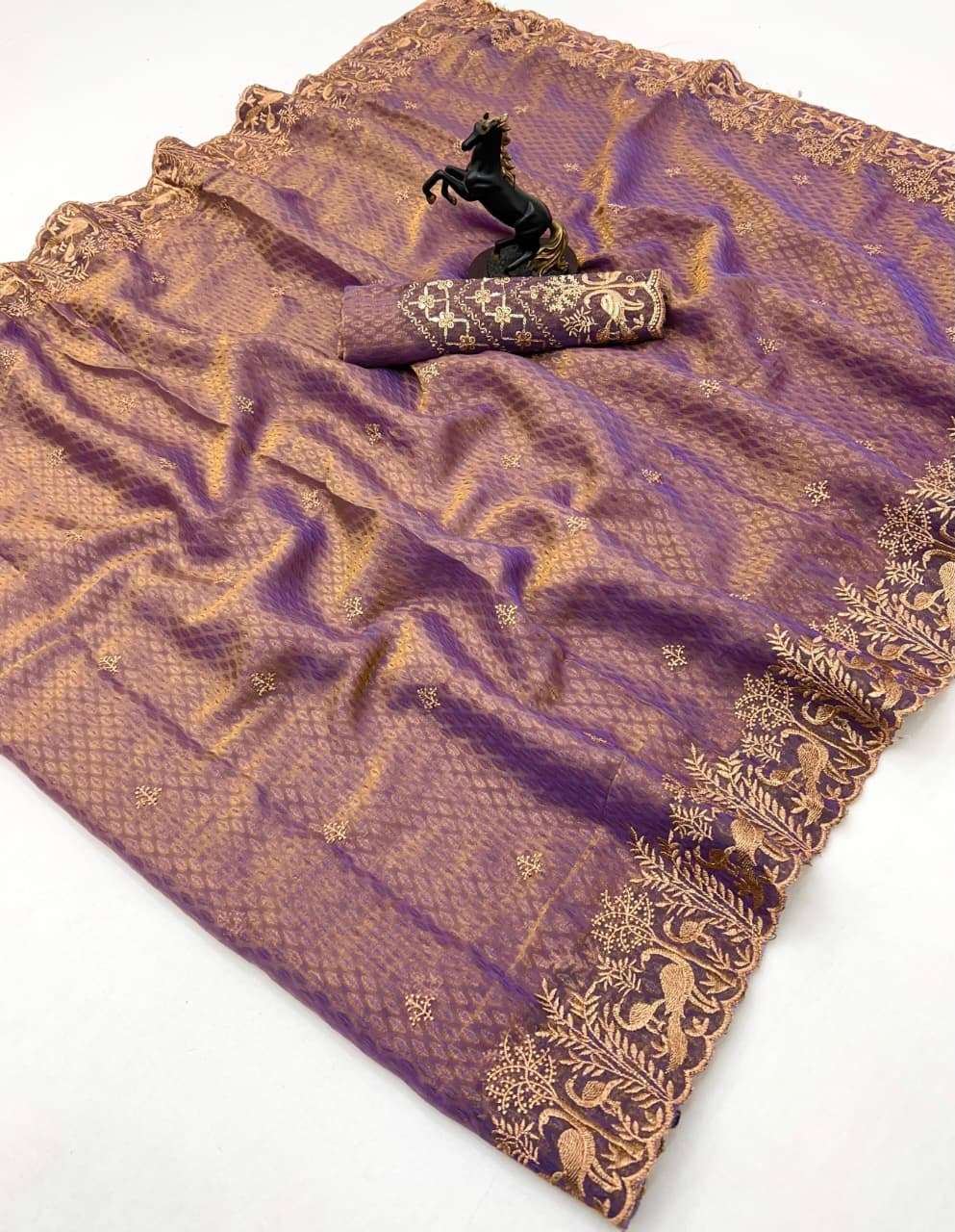 This elegant saree is crafted from premium two tone crushed ...