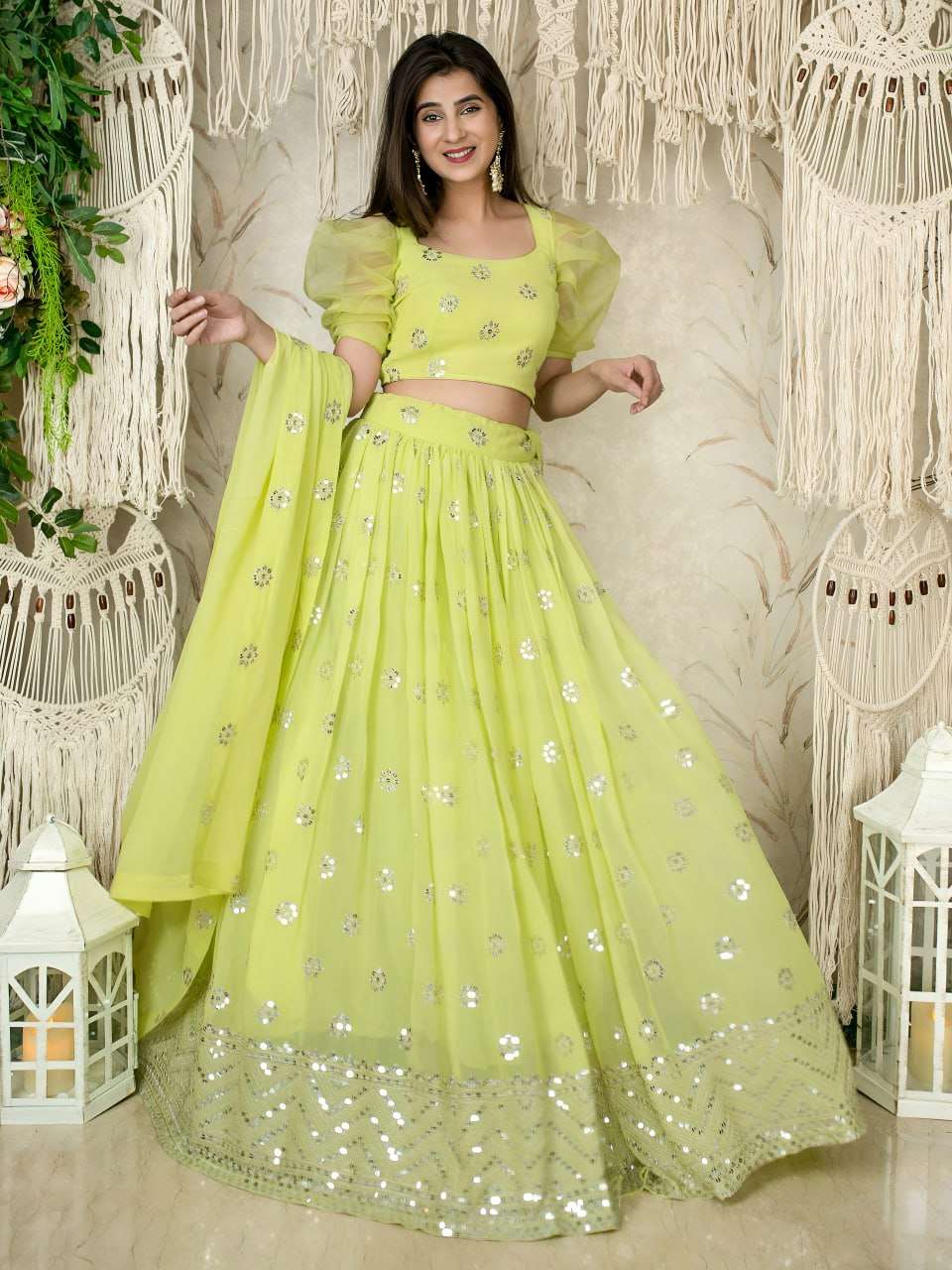 This lime green lehenga set is adorned with delicate sequins...