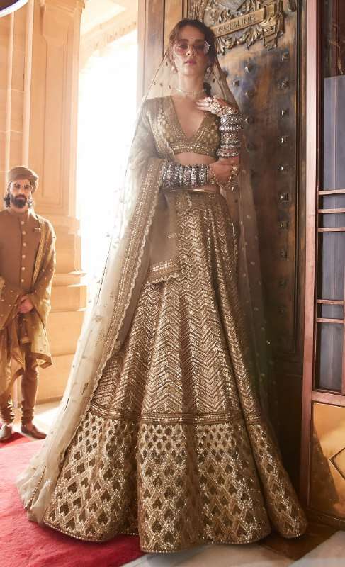 This luxurious and designer Antique Gold Bridal lehenga set ...