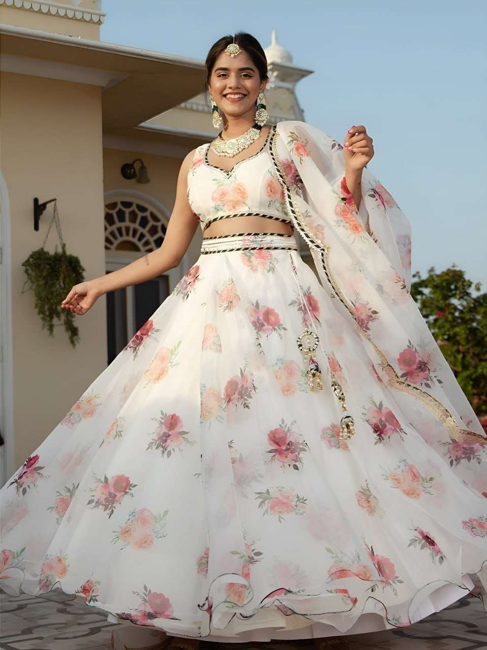 This white floral lehenga set brings a soft and romantic vib...