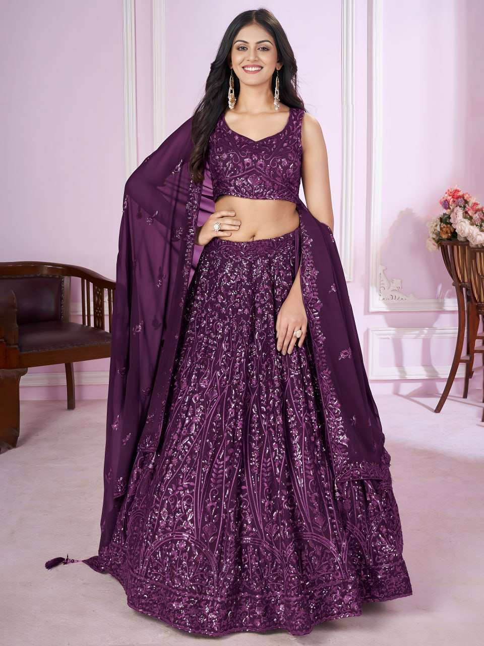 This wine purple lehenga choli exudes royal charm with its i...
