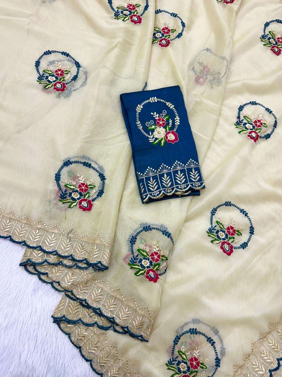 Grace your look with this beautiful Premium Rangoli Silk fan...