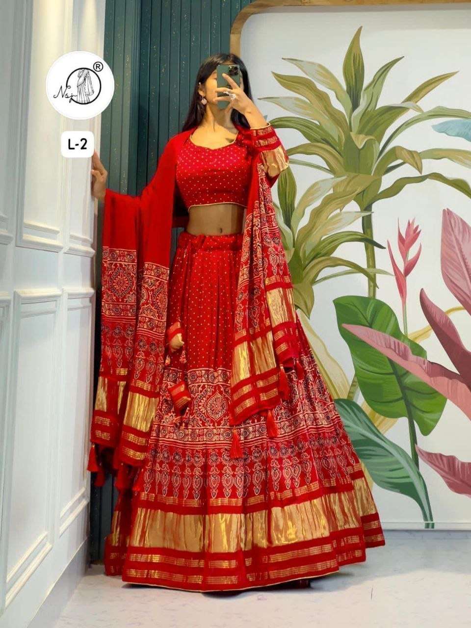 Pure and regal Gaji Silk designer ajrakh print work on lehen...