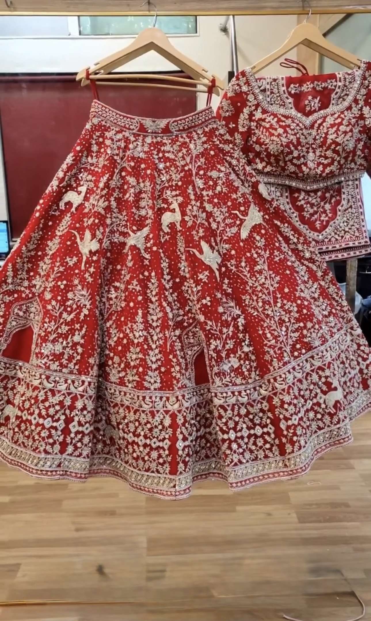 BRIDAL WEAR MADE OF HEAVY SOFT NET FABRIC HEAVY EMBROIDERY WORK ON LEHENGA CHOLI SUPPLIER IN SURAT MT 1057 