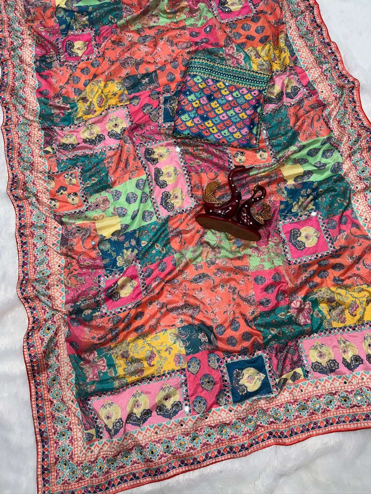 Soft and pure Chinnon fabric with beautiful print On this saree wholesale in surat 