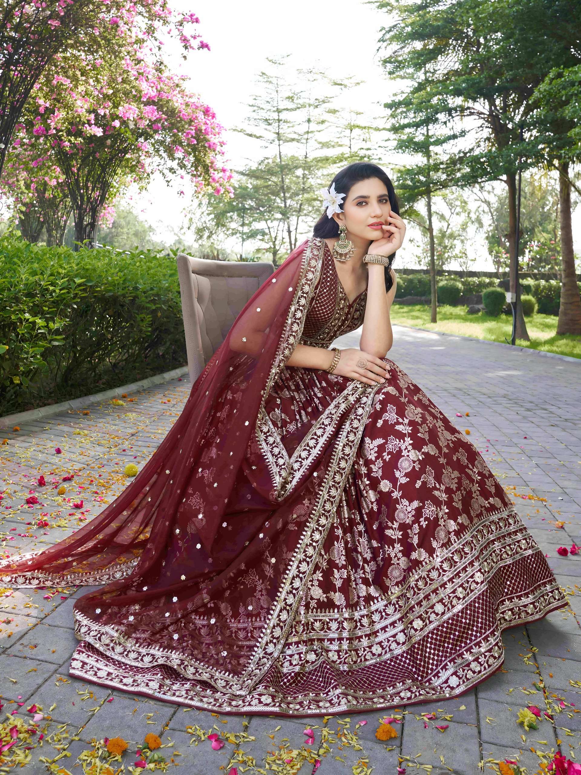 The lehenga is crafted from rich dola silk jacquard fabric in Maroon Garden Royale colour lehenga choli at the best rate 7100 Maroon  